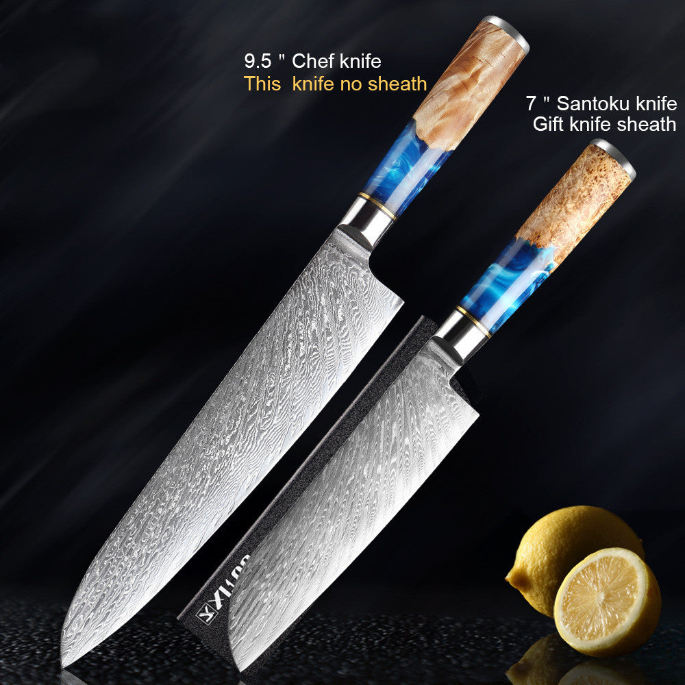 Two knives with decorative handles on a dark background, one labeled as a chef knife and the other as a Santoku knife with a lemon.