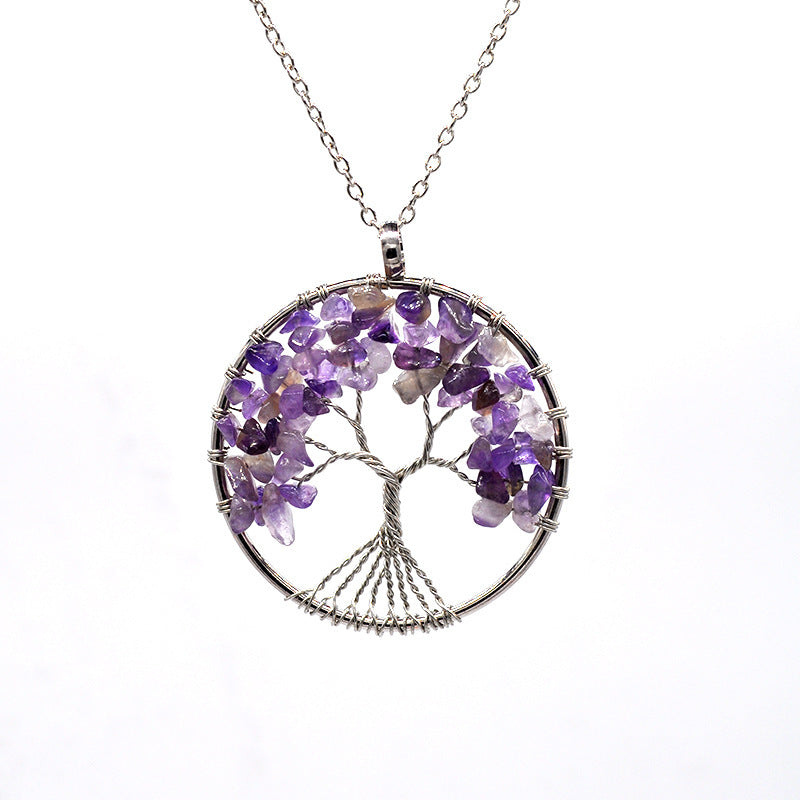 Tree of Life necklace with purple gemstones on a white background