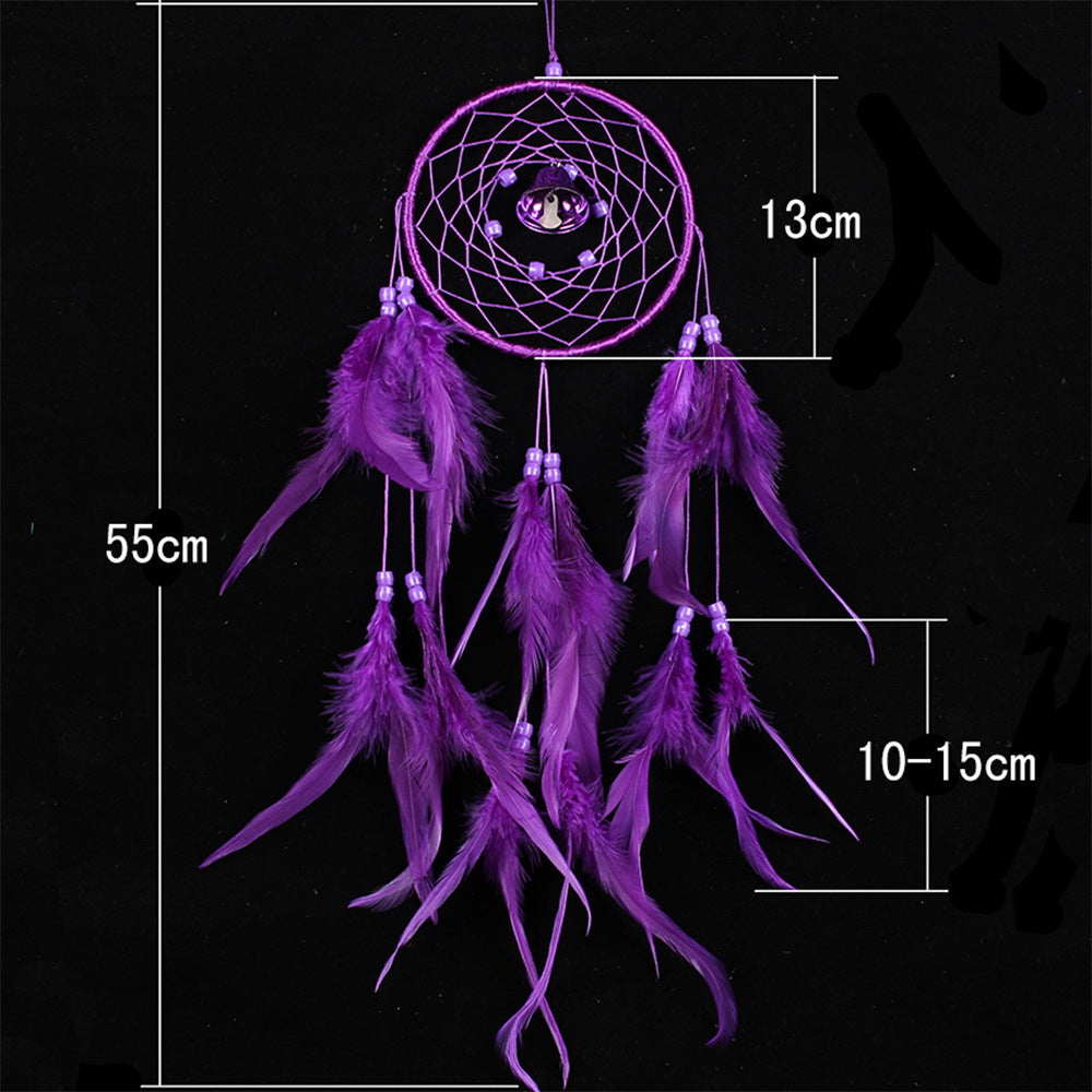 Purple dreamcatcher with feathers and measurements on a black background