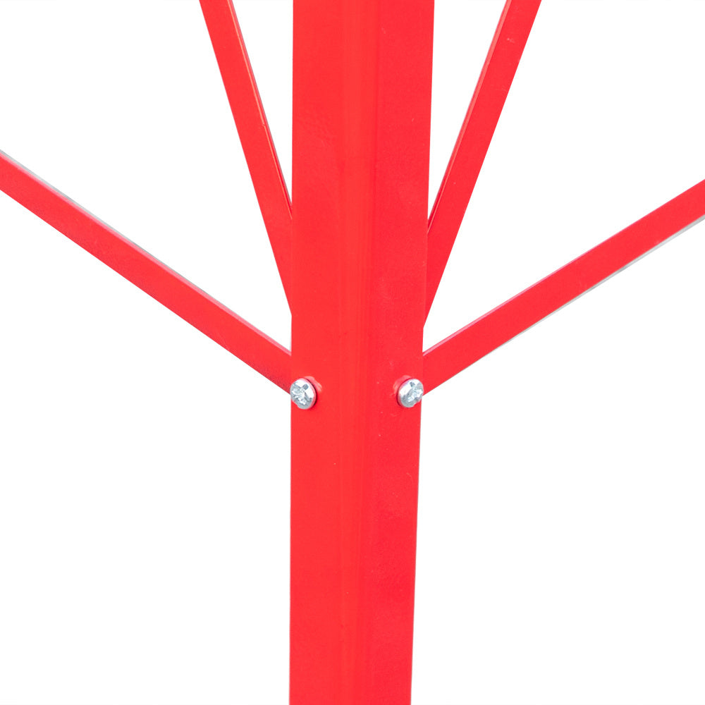 Close-up of a red metal tree sculpture on a white background