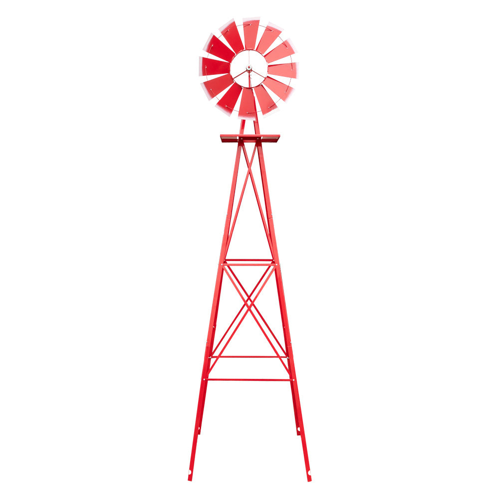Red metal windmill on a white background