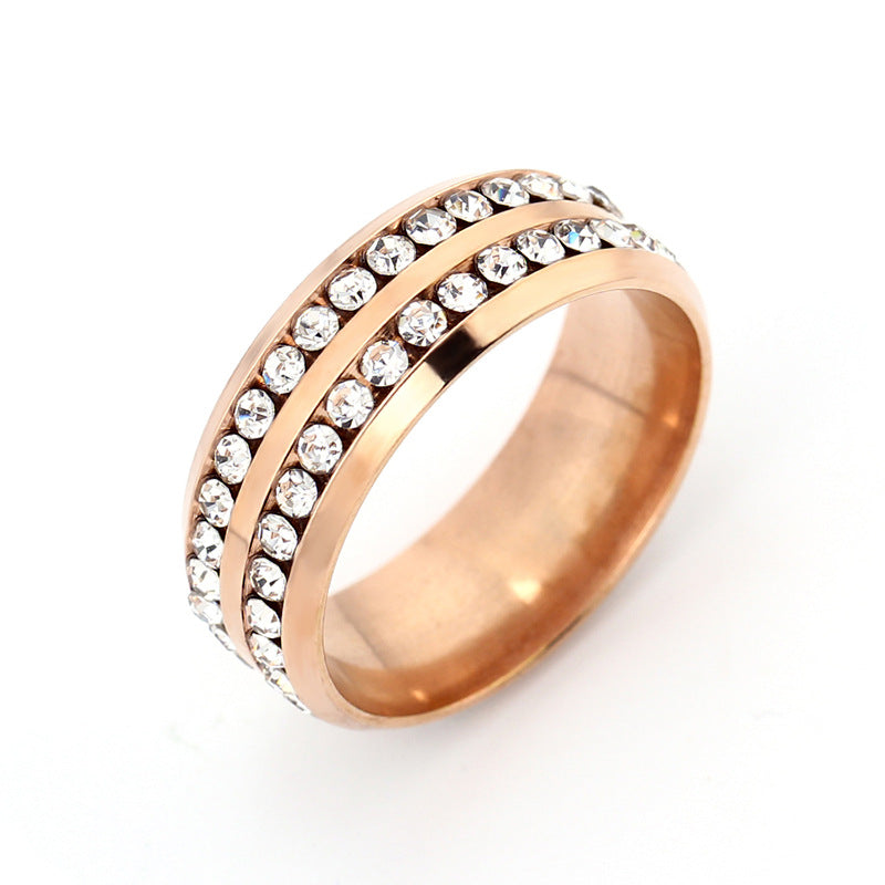Rose gold ring with crystal stones on a white background