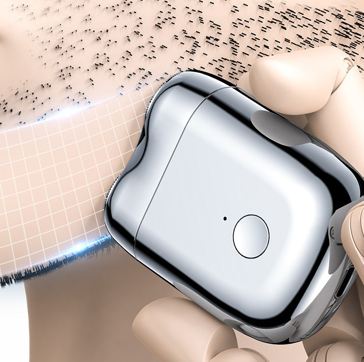 Chrome device with a button on a beige background