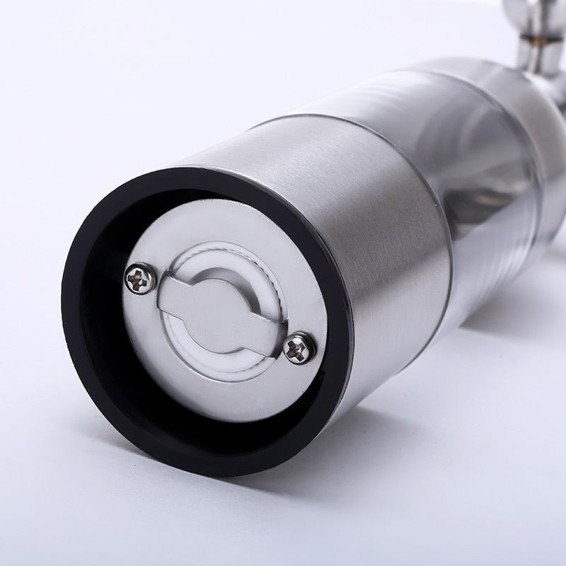 Close-up of a metallic object with a black and silver design on a white background