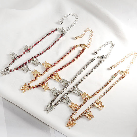 Set of butterfly-themed bracelets in various colors on a white surface