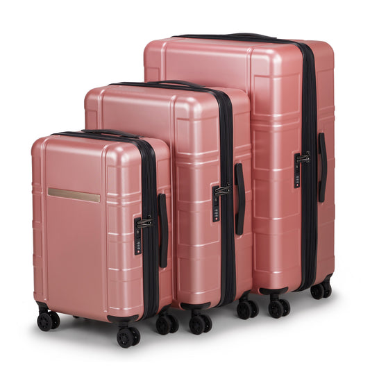 Set of three pink suitcases with black handles and wheels on a white background