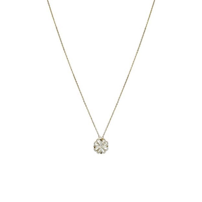 Gold necklace with a diamond pendant on a white background