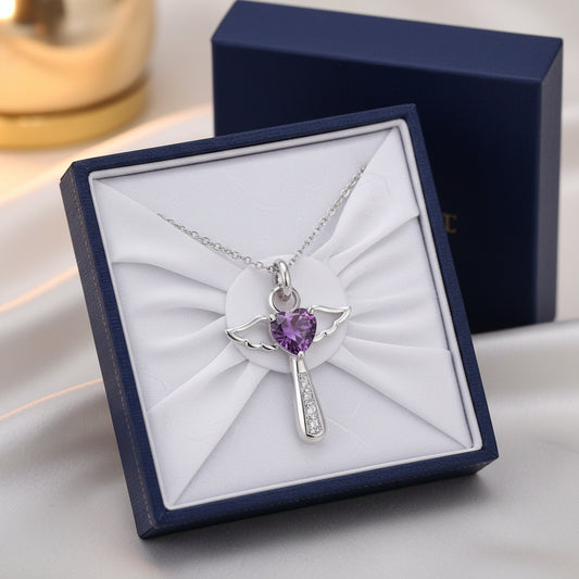 Silver angel pendant with a purple heart-shaped gem in a gift box for her