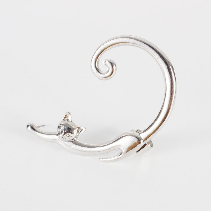 Silver cat-shaped earring on a white background