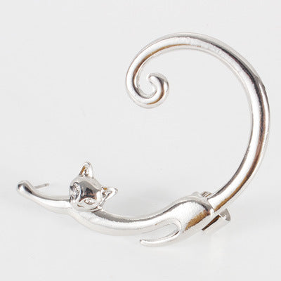Silver cat-shaped brooch on a white background