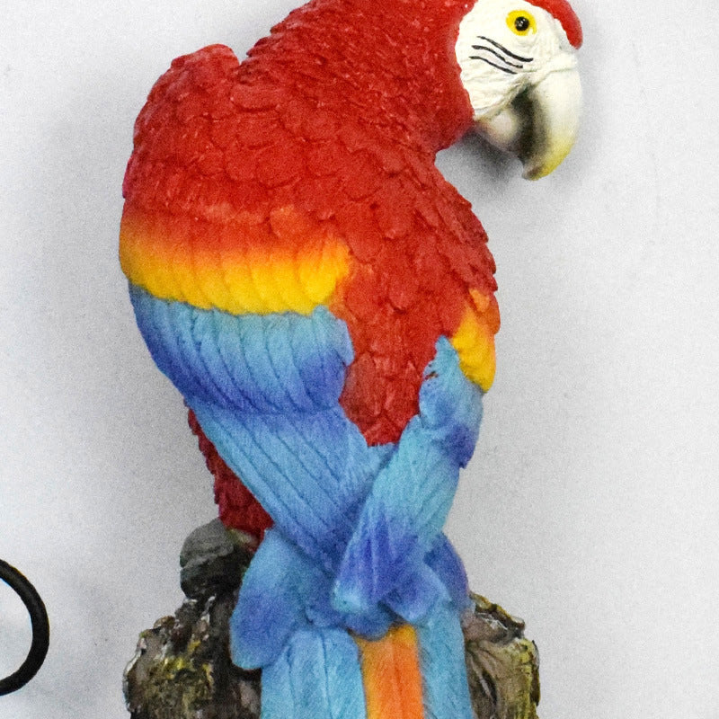 Colorful parrot figurine on a white background