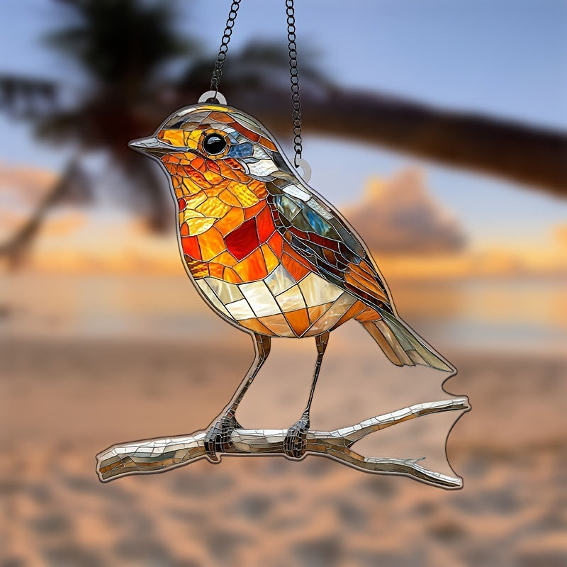 Stained glass bird sculpture on a branch with a blurred natural background