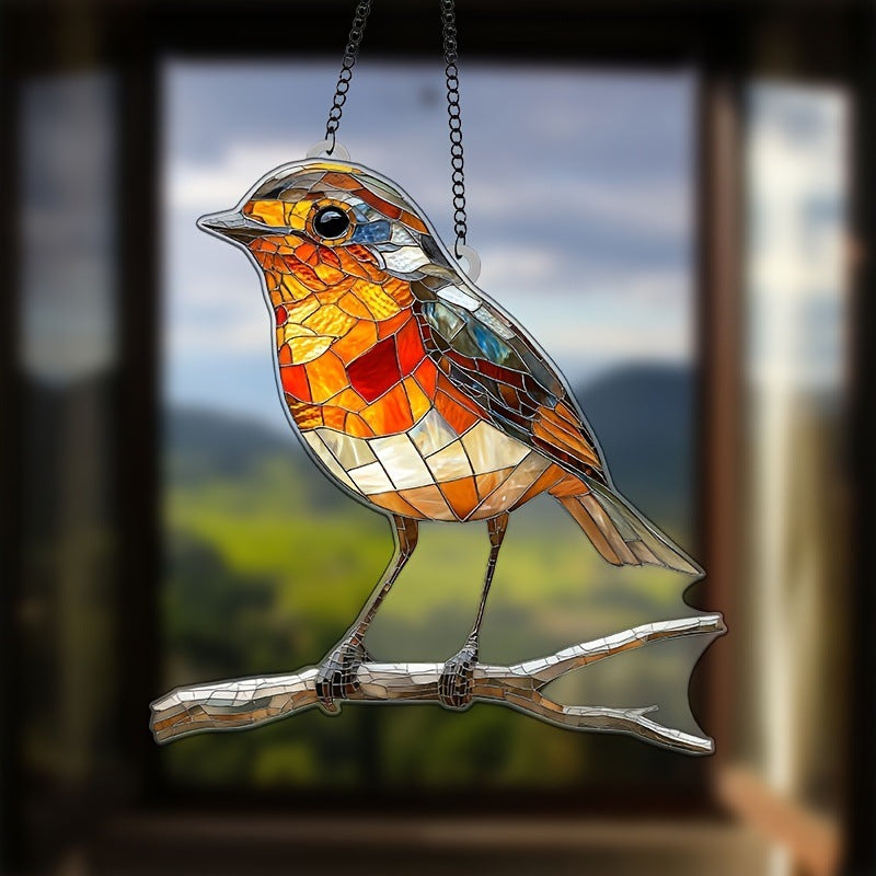 Stained glass bird on a branch with a blurred landscape background