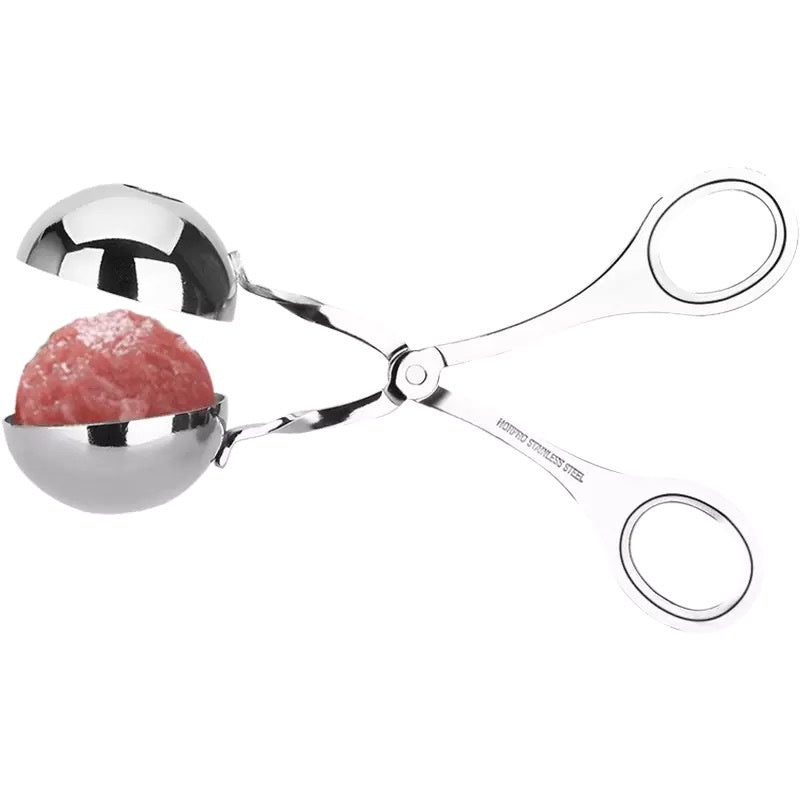 Metallic meat tenderizer with a piece of meat inside on a white background
