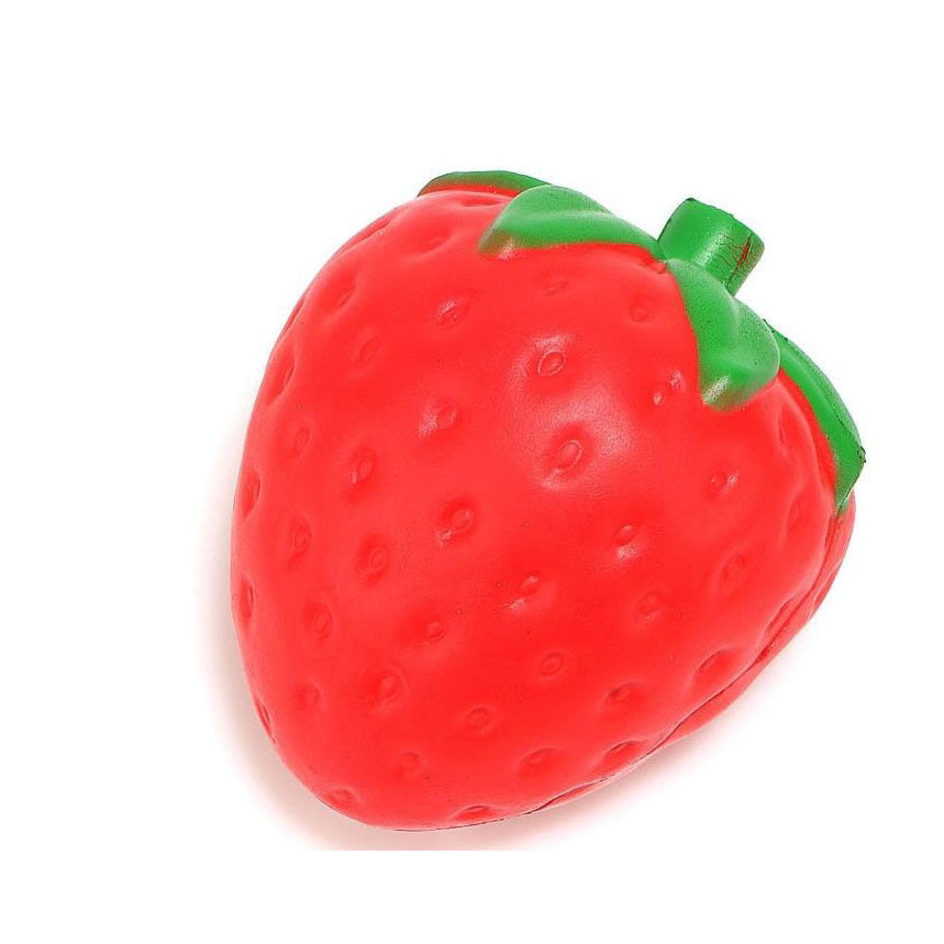 Red strawberry-shaped object with green leaves on a white background