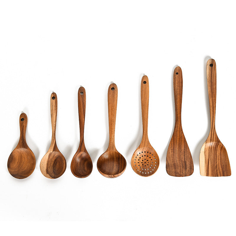 Set of wooden cooking utensils on a white background