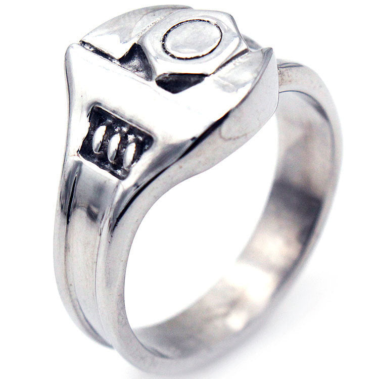 Silver ring with a detailed design on a white background