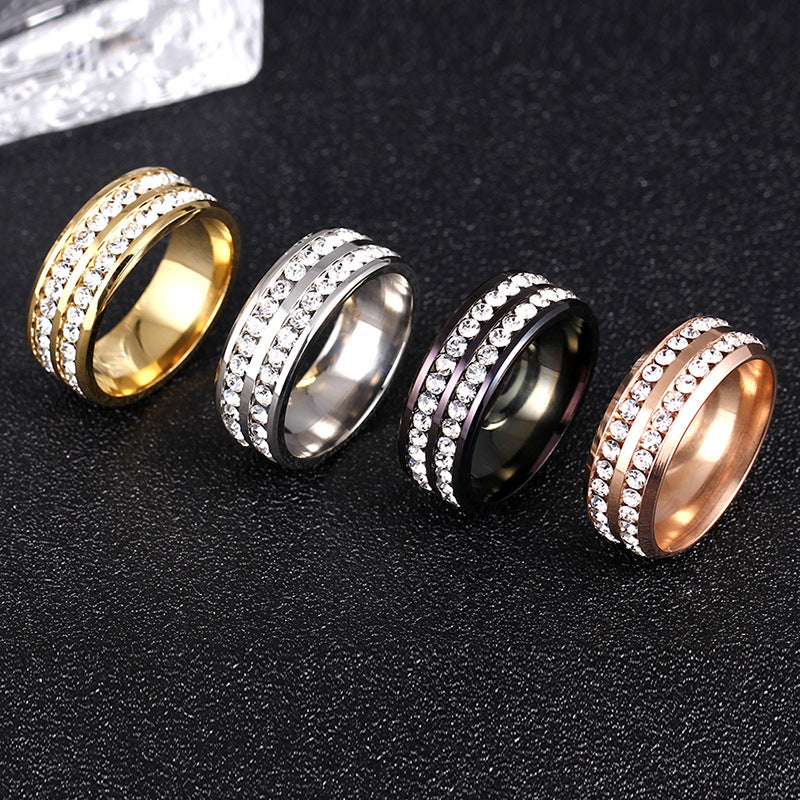 4 Titanium diamond rings on black background