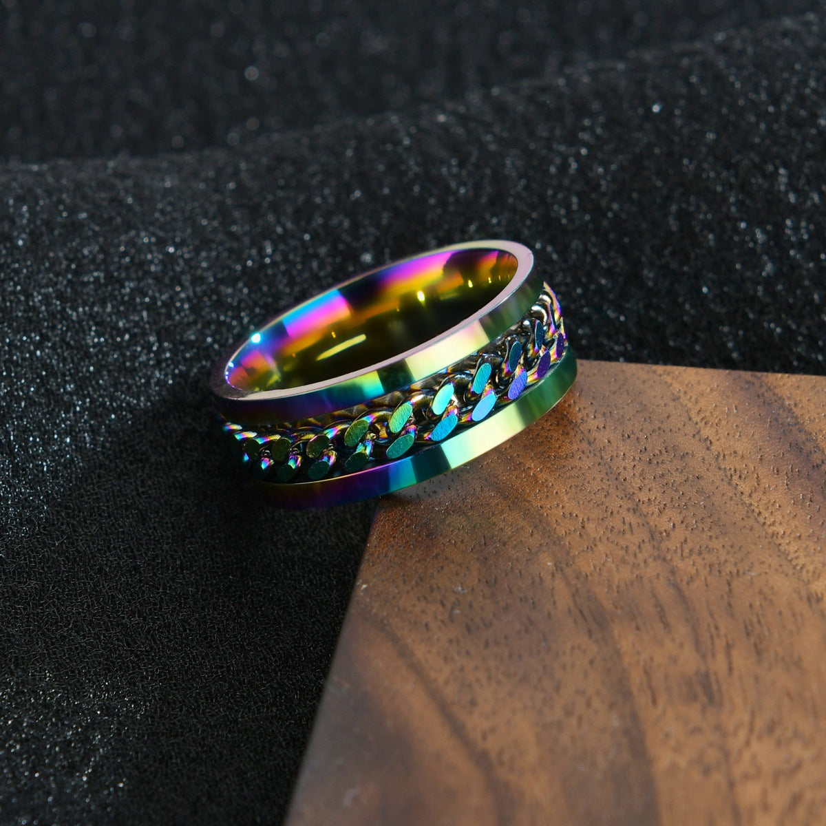 Multicolored ring on a dark textured surface