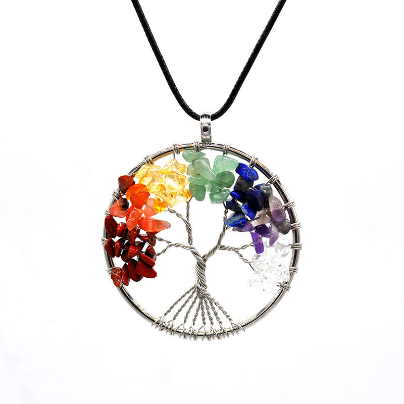 Tree of Life pendant with colorful stones on a white background