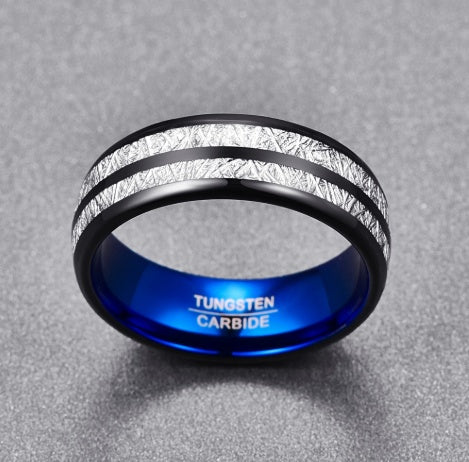 Tungsten carbide ring with blue interior on a gray background