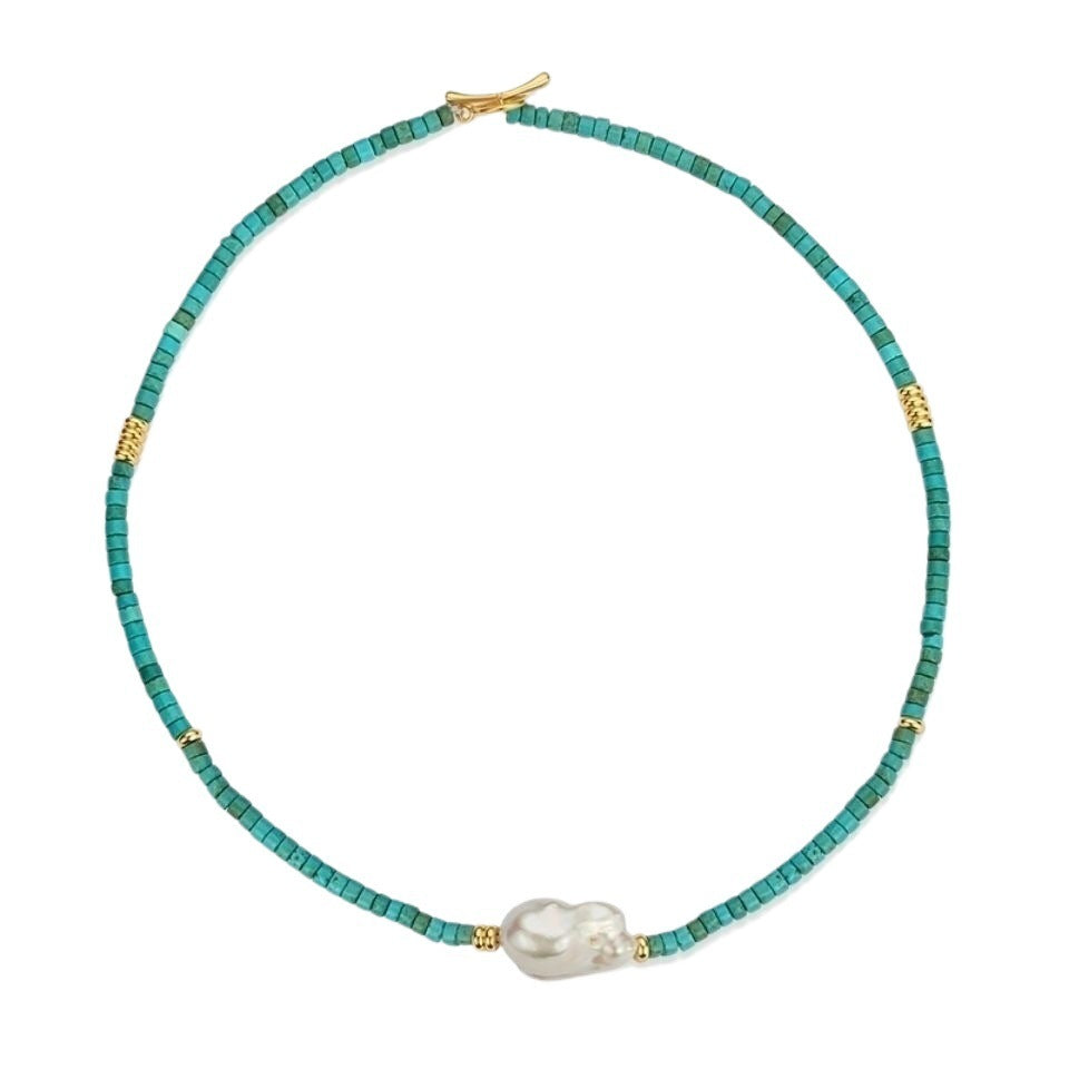Turquoise beaded necklace with a pearl pendant on a white background