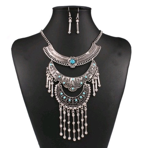 Jewelry set with necklace and earrings on a black mannequin
