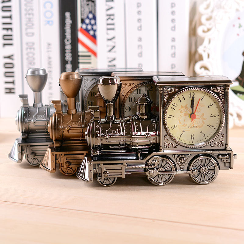 Vintage-style train clock on a wooden surface with books in the background