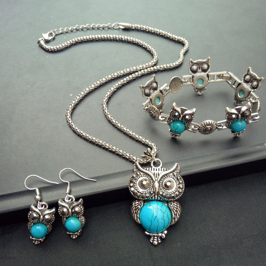 Vintage Turquoise Owl Jewelry Set Necklace Earrings Bracelet on table