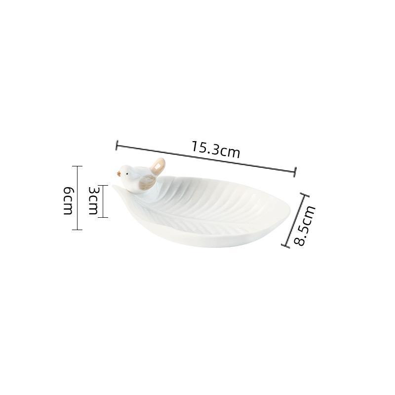 White ceramic dish with measurements on a white background