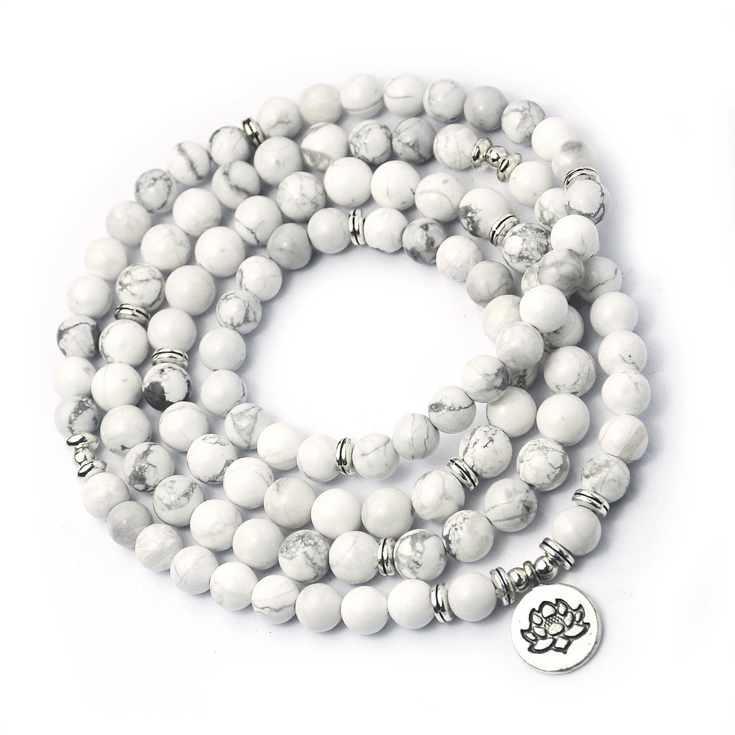 White beaded bracelet with silver accents on a white background