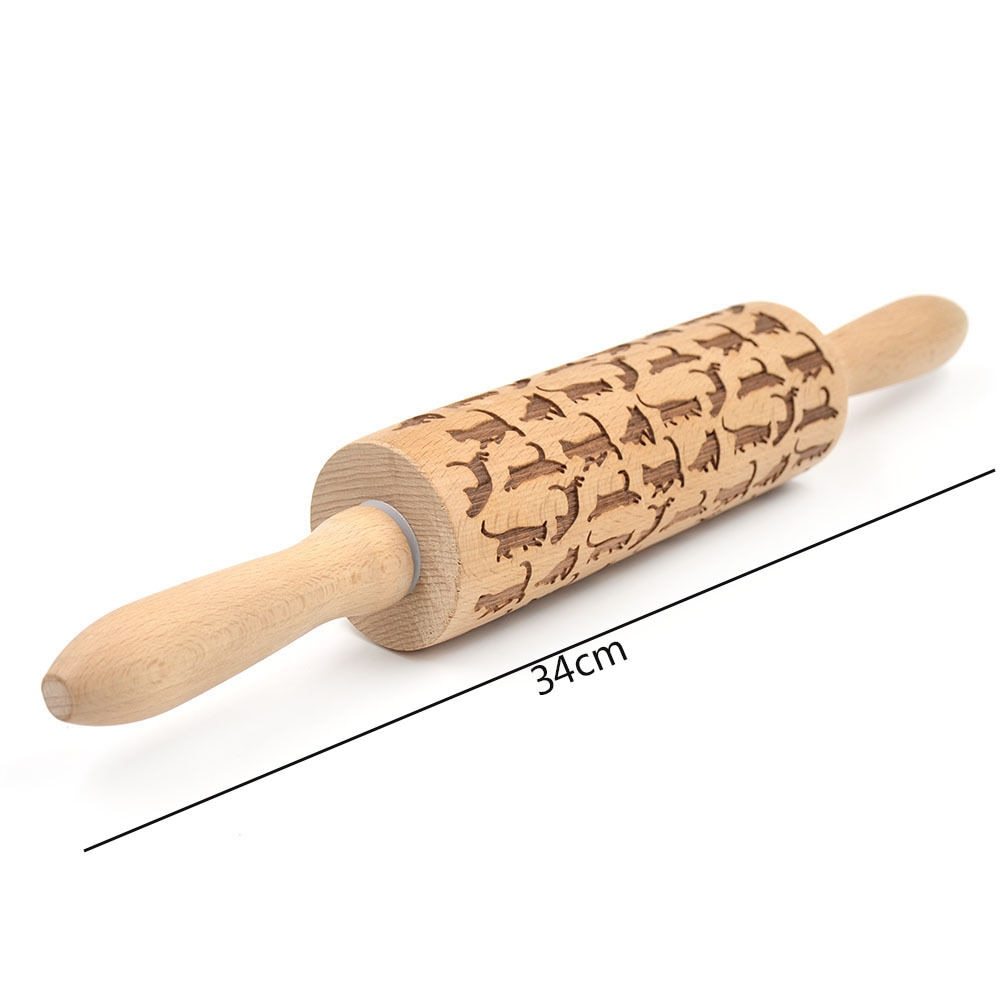 Wooden rolling pin with engraved patterns on a white background