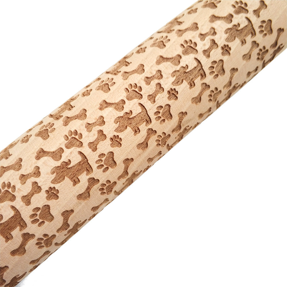 Rolling pin with dog-themed patterns on a beige background