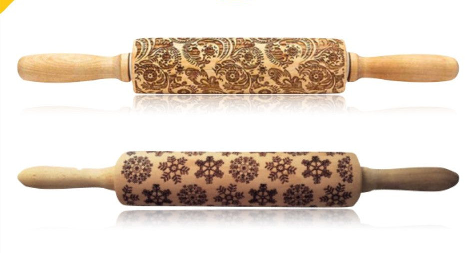 Two wooden rolling pins with engraved patterns on a white background