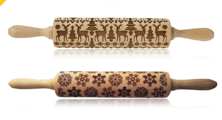 Two wooden rolling pins with engraved patterns on a white background