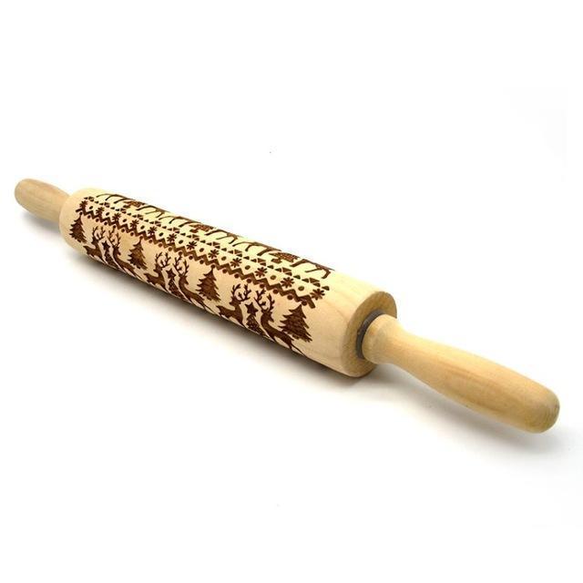 Wooden rolling pin with engraved pattern on a white background
