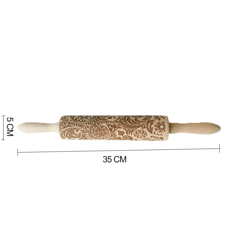 Wooden rolling pin with floral patterns and measurements on a white background