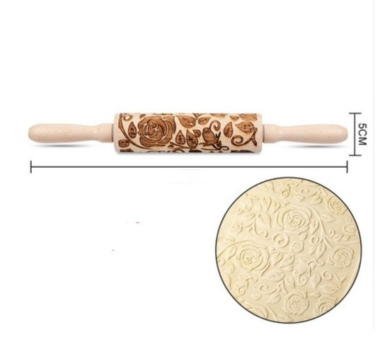Wooden rolling pin with embossed floral patterns and a close-up of the embossed design on a white background.