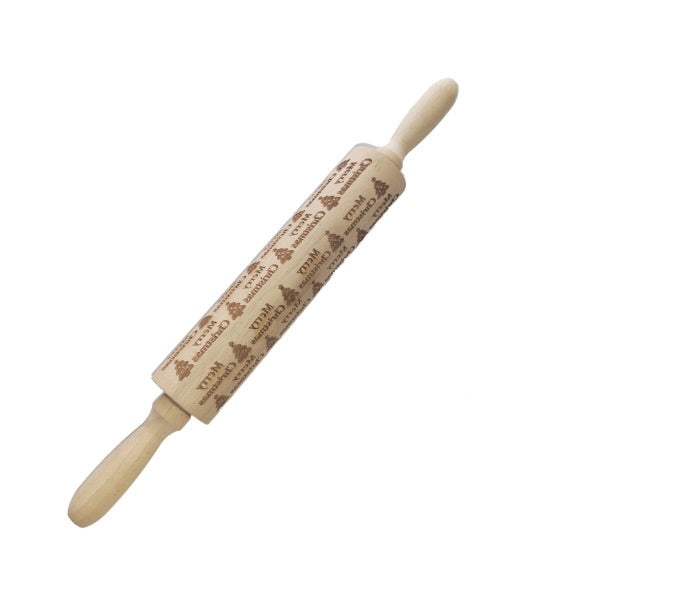 Wooden rolling pin with engraved design on a white background