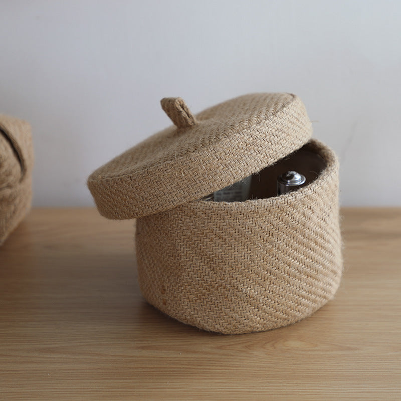 Woven basket with a lid on a wooden surface