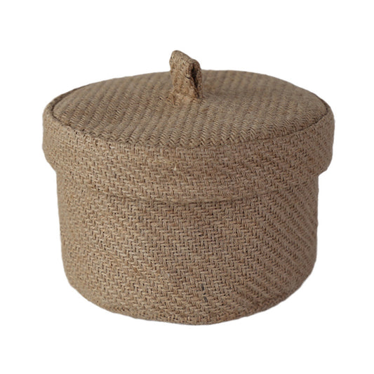 Woven brown ottoman with a lid on a white background