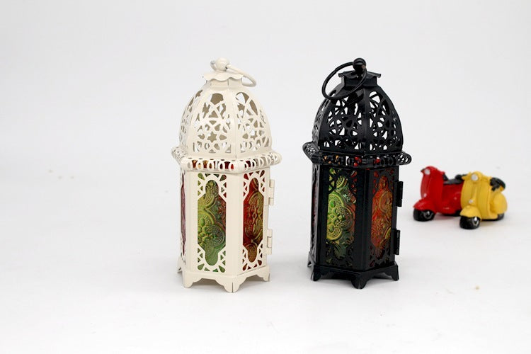 Two ornate lanterns, one white and one black, on a white background.