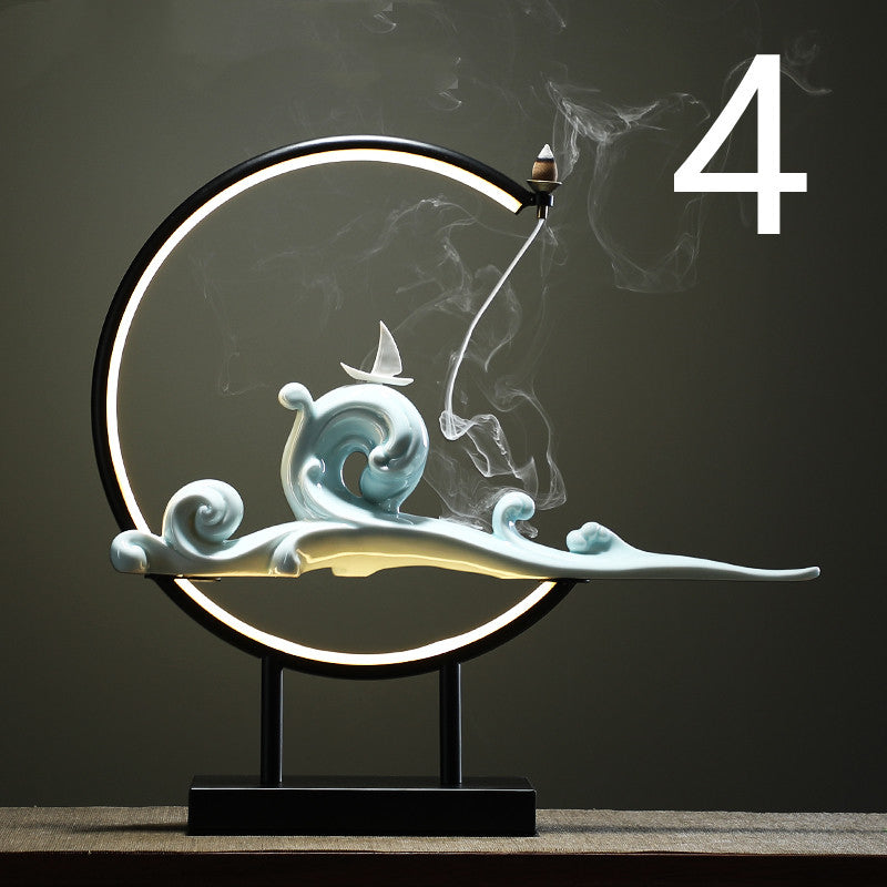 Decorative lamp with wave and smoke design on a dark background  incense burner