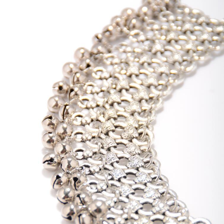Close-up of a silver bracelet on a white background