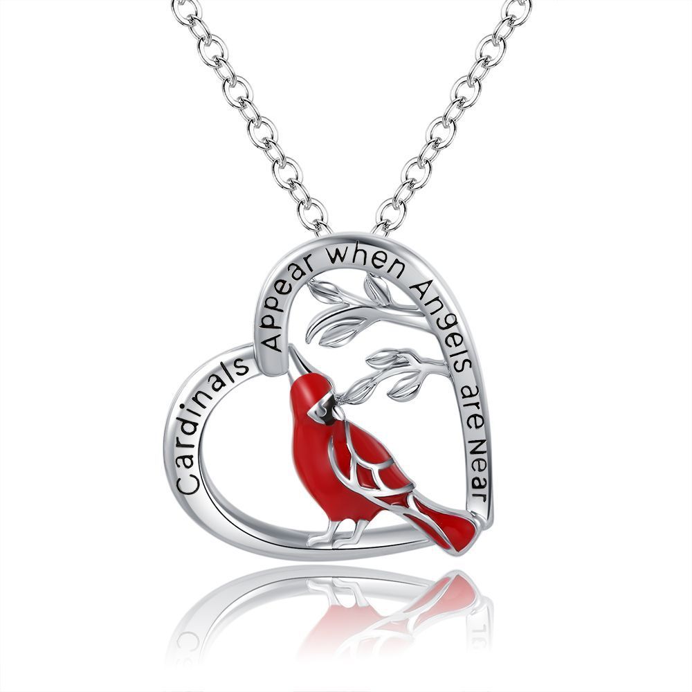 Silver necklace with a red cardinal pendant on a white background