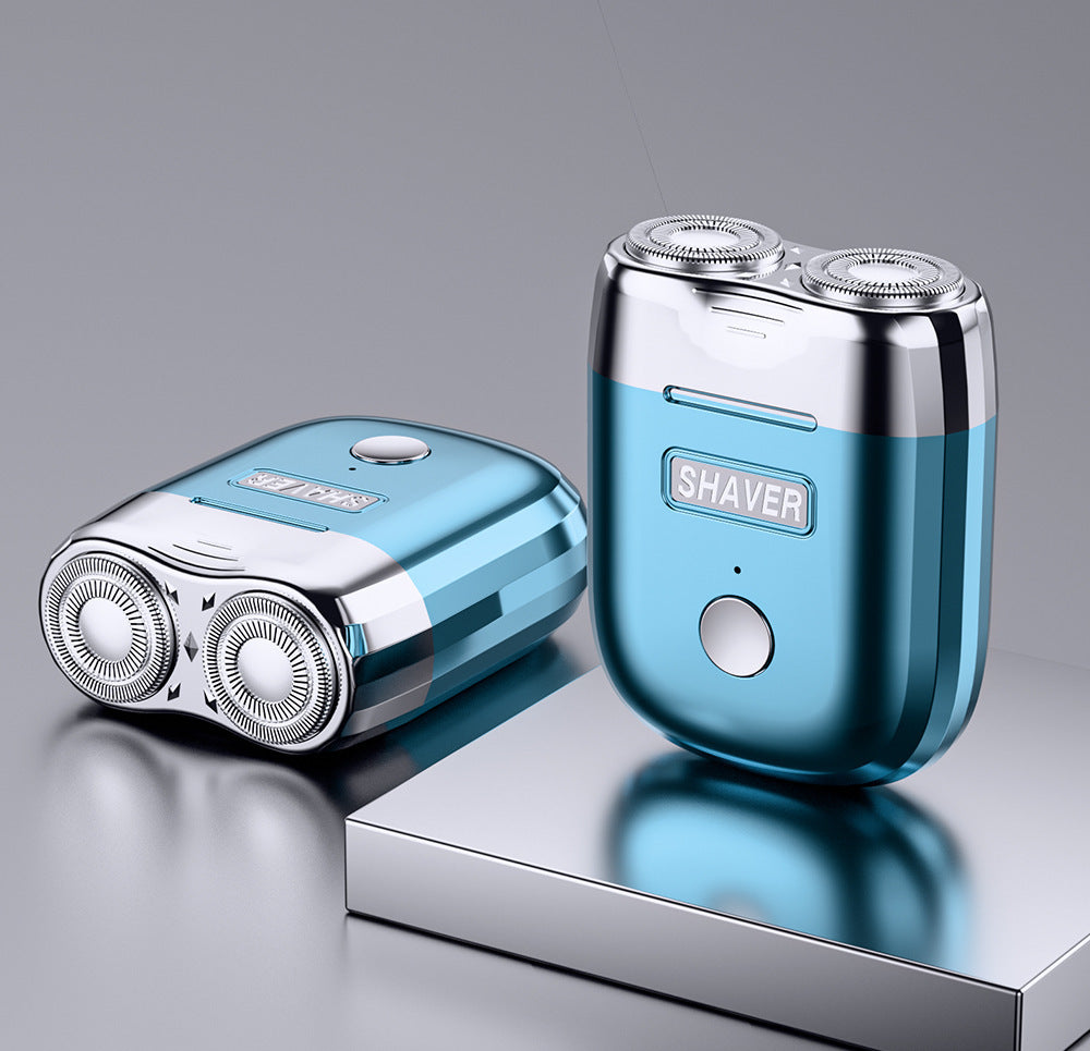 Blue and silver shaver on a reflective surface with a gray background