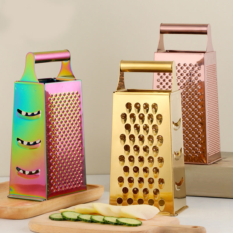 Three colorful box graters on a neutral background with sliced vegetables.
