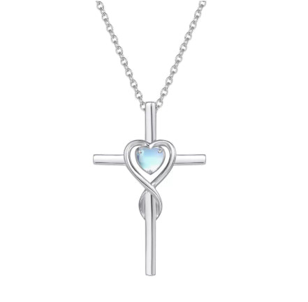 Birthstone  Silver cross necklace with a heart-shaped gem on a white background