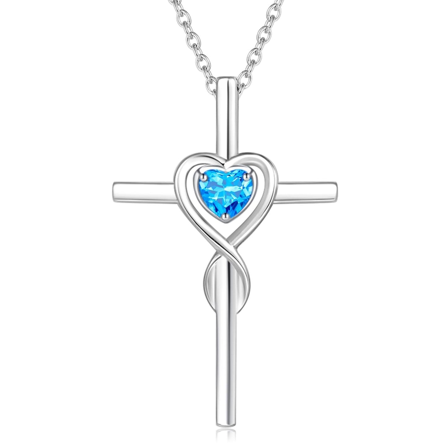 Birthstone  Silver cross pendant with a heart-shaped blue gemstone on a white background