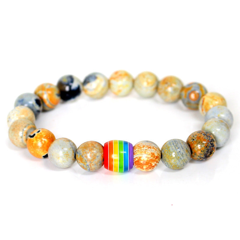 Multicolored beaded bracelet with a rainbow stripe on a white background